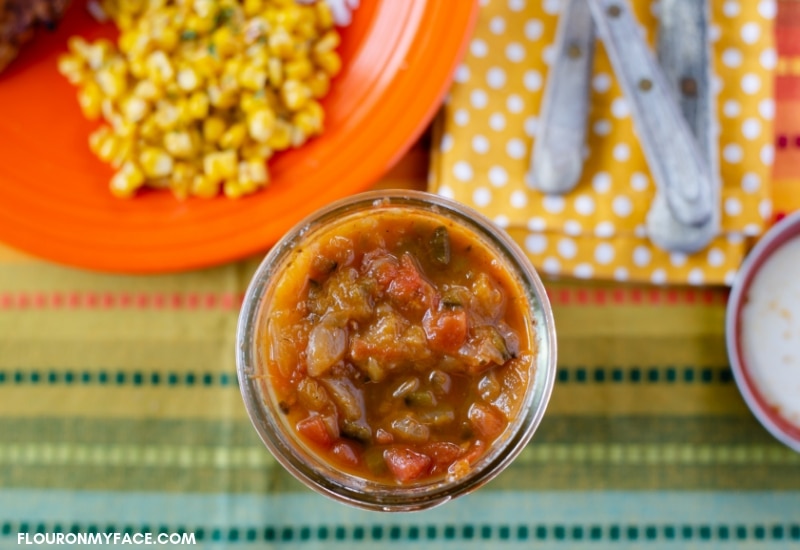 Homemade canned Roasted Pepper, Onion, Tomato and Peach salsa recipe in a mason jar