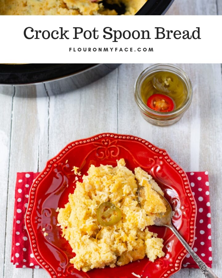 Crock Pot Spoon Bread served on a plate with jalapeno pepper slices.