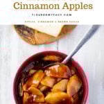 A brown bowl filled with Instant Pot Cinnamon Apples and a sliced pound cake on a wooden cutting board.