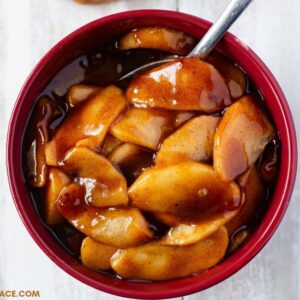 Instant Pot Cinnamon Apples recipe with a thick brown sugar glaze in a serving bowl.