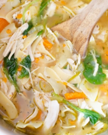 Homemade Instant Pot Chicken Noodle Soup recipe with fresh spinach leaves