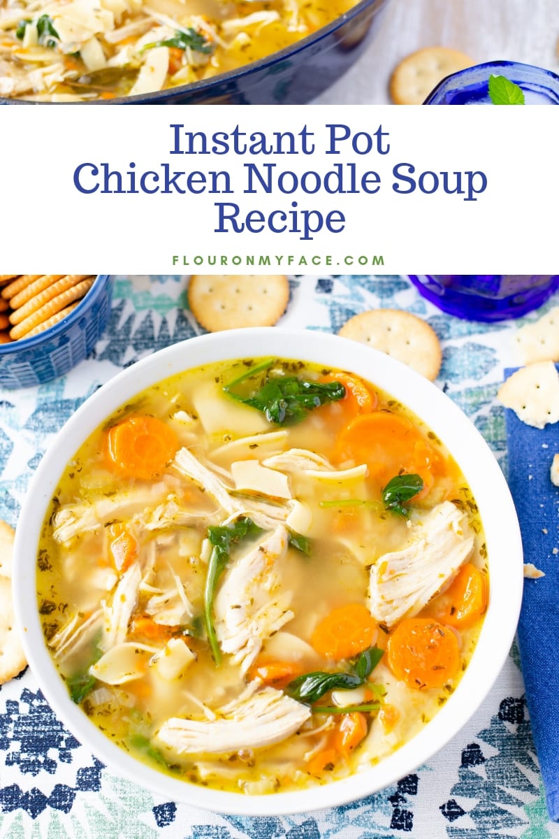 A bowl of Instant Pot Chicken Noodle Soup recipe served in a white bowl, on a blue place mat with a navy blue napkin. Served with crackers.