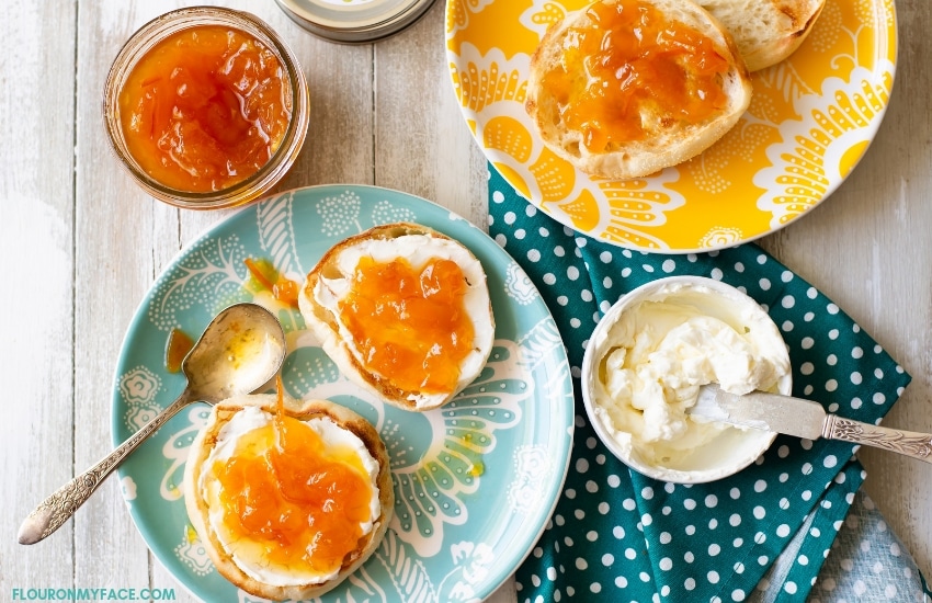 Homemade marmalade on cream cheese and toasted English muffins