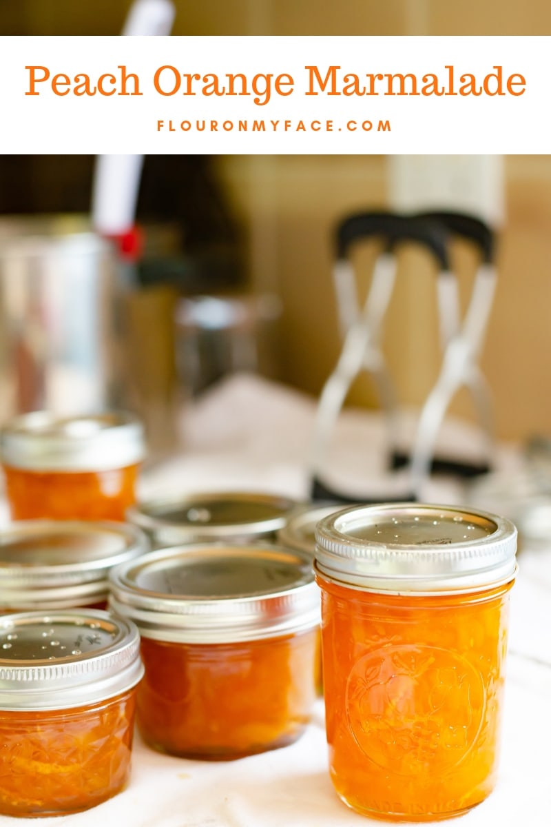 Canning jars filled with homemade Peach Orange Marmalade
