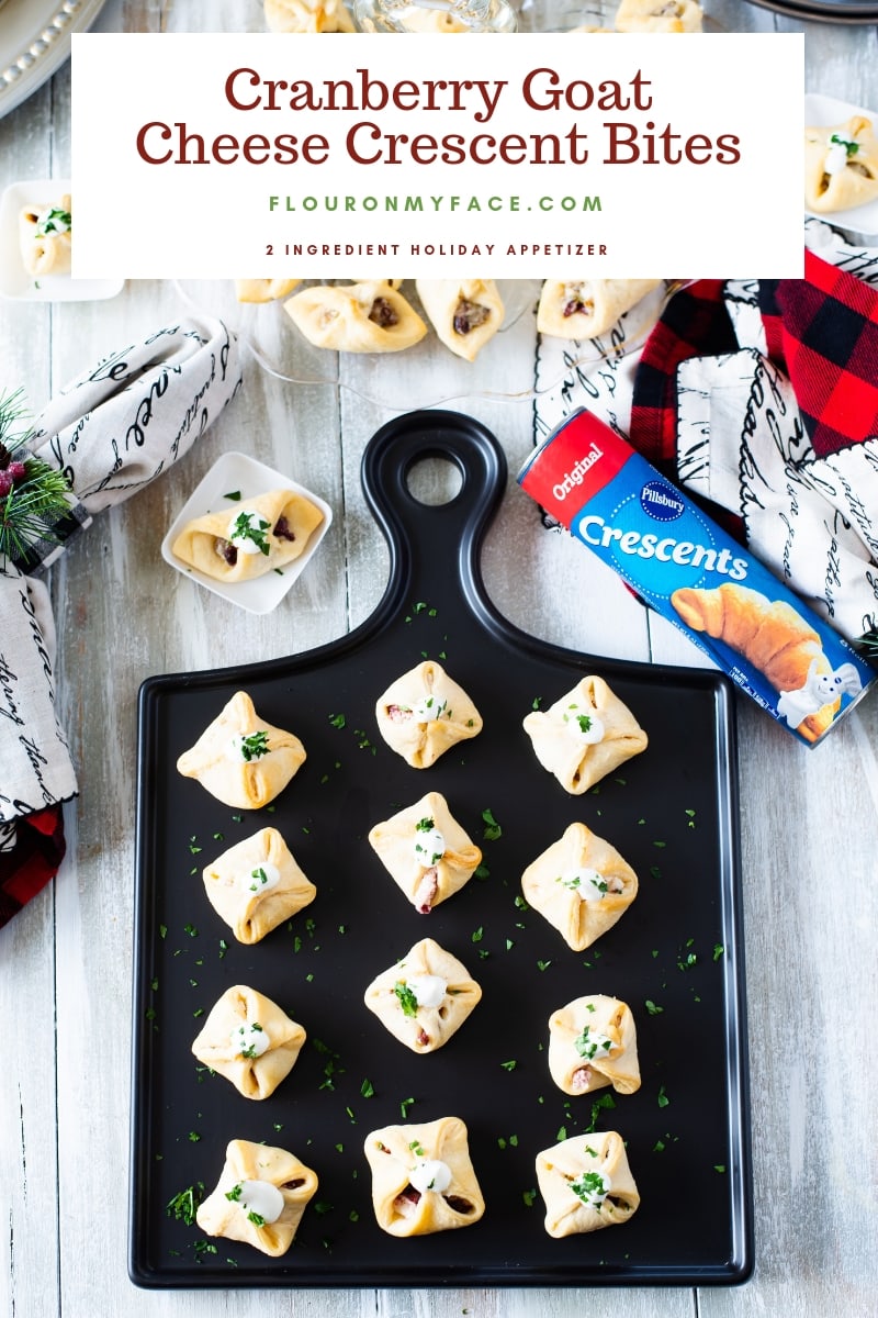 Cranberry Goat Cheese Crescent Bites on a black appetizer tray