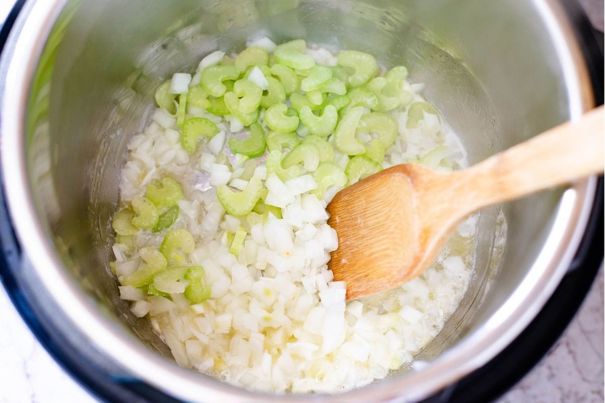 Sautéing onions and celery in the Instant Pot.
