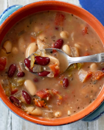 A bowl of Spicy Bean Soup with a spoon.