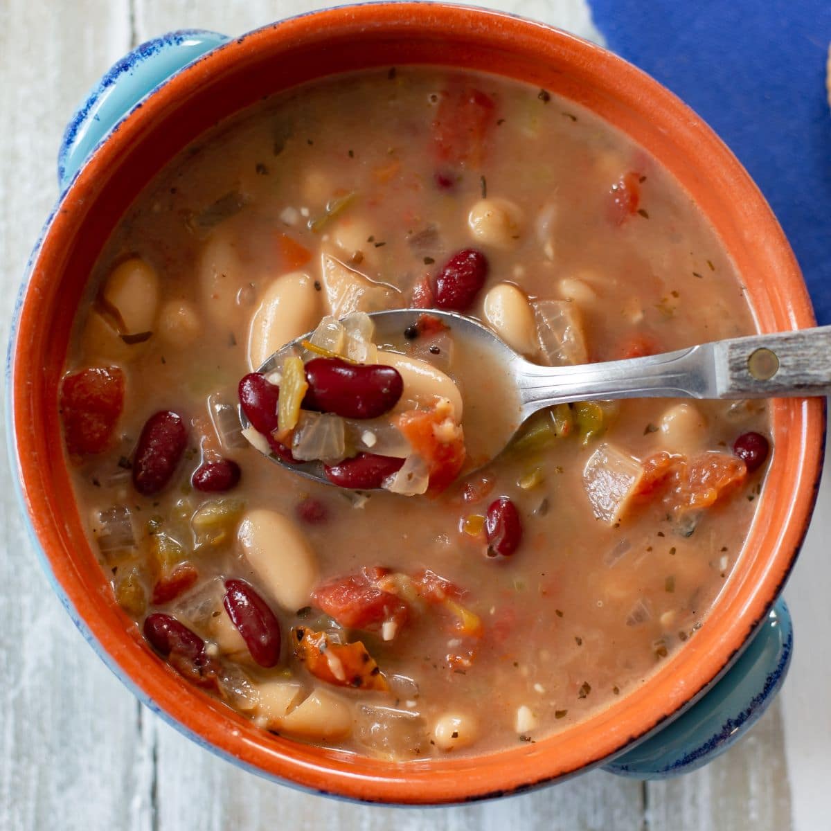 A bowl of Spicy Bean Soup with a spoon.