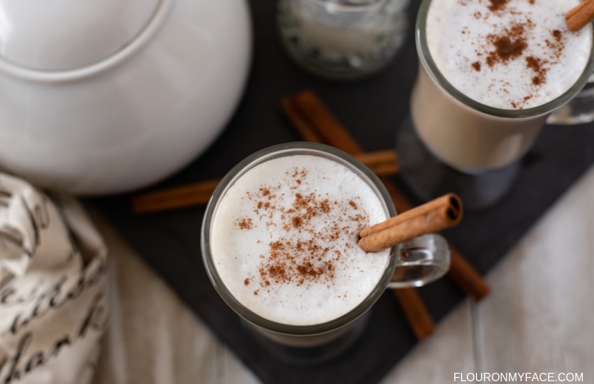 A mug of Crock Pot Chai Tea Lattes served with frothy milk.