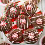 round chocolate peppermint cookies topped with a white and red Hersey's peppermint kiss