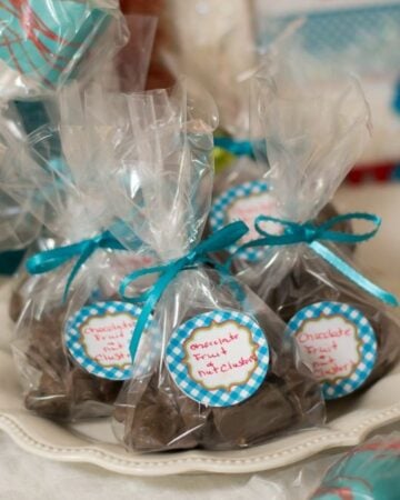 Chocolate Nut Clusters wrapped in cellophane bags and tied with a ribbon.