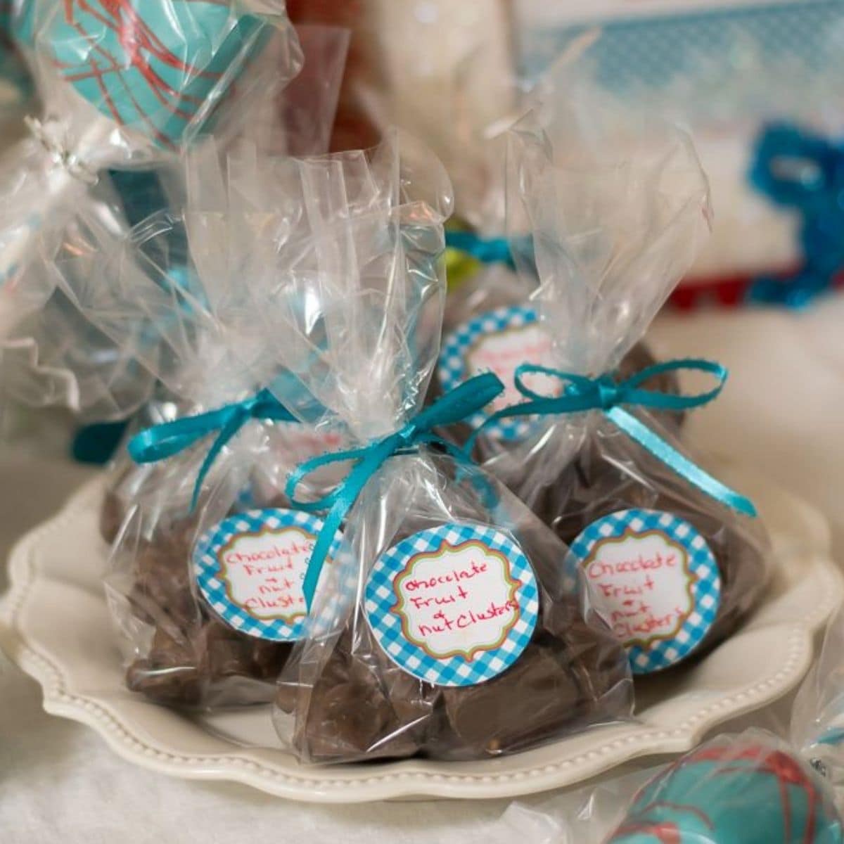 Chocolate Nut Clusters wrapped in cellophane bags and tied with a ribbon.