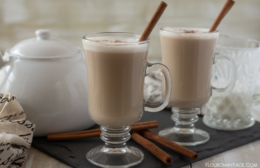 Two mugs and a white tea pot filled with Chai Tea Lattes recipe
