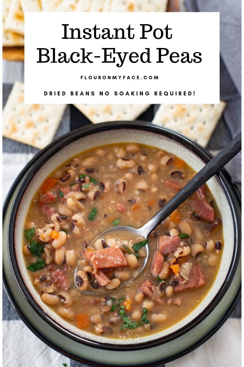 Bowl of Instant Pot Black Eyes Peas recipe on a black and white cloth napkin served in a grey bowl with a black border.