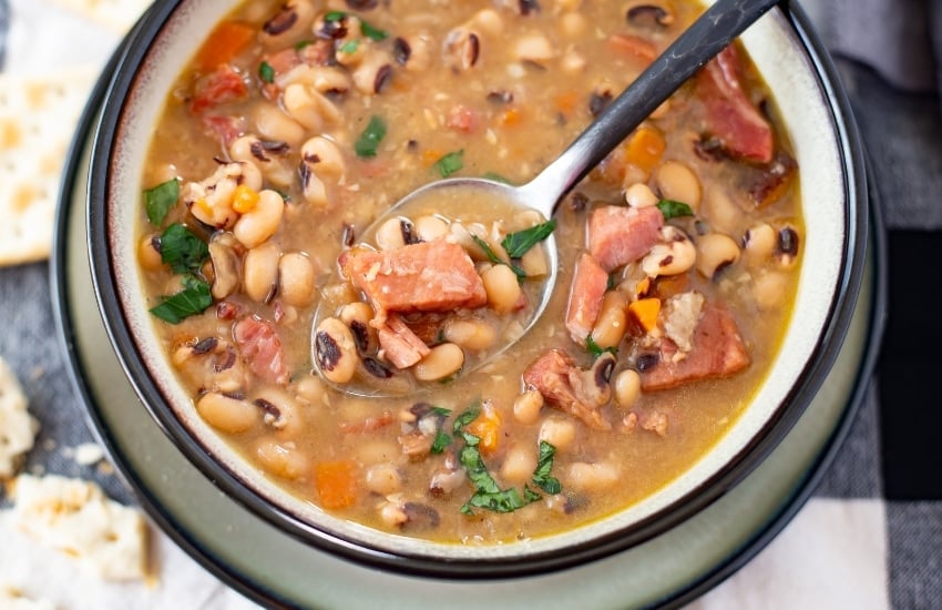 a bowl and spoon of Instant Pot Black-Eyed Peas recipe