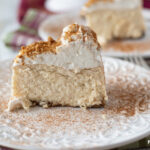 A slice of Instant Pot Eggnog Cheesecake on a dessert plate