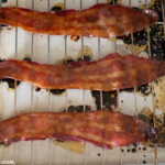 Warm brown sugar bacon on a baking pan.