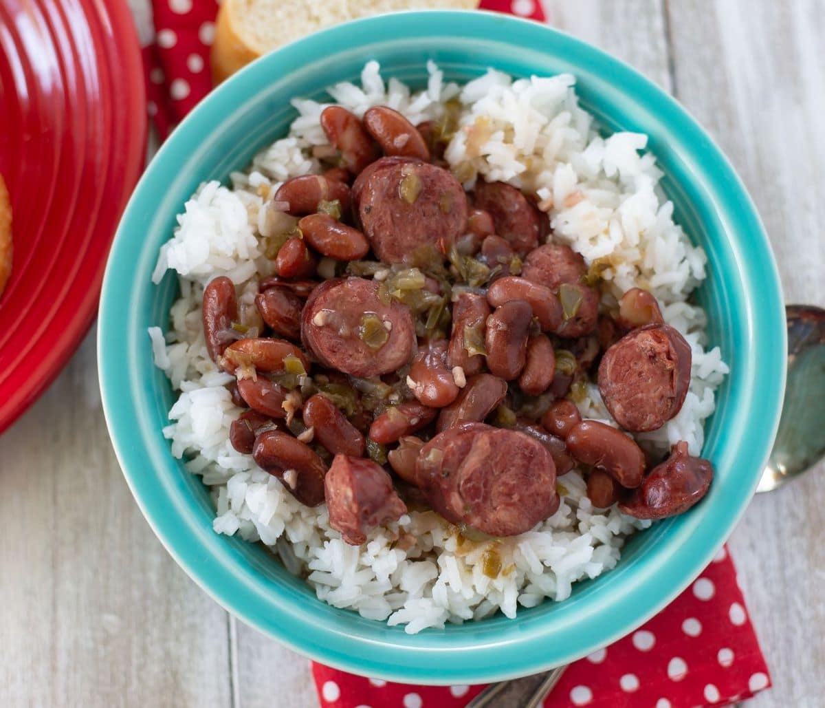 Spicy Cajun Red Beans and Rice served in a teal Fiesta ware bowl.