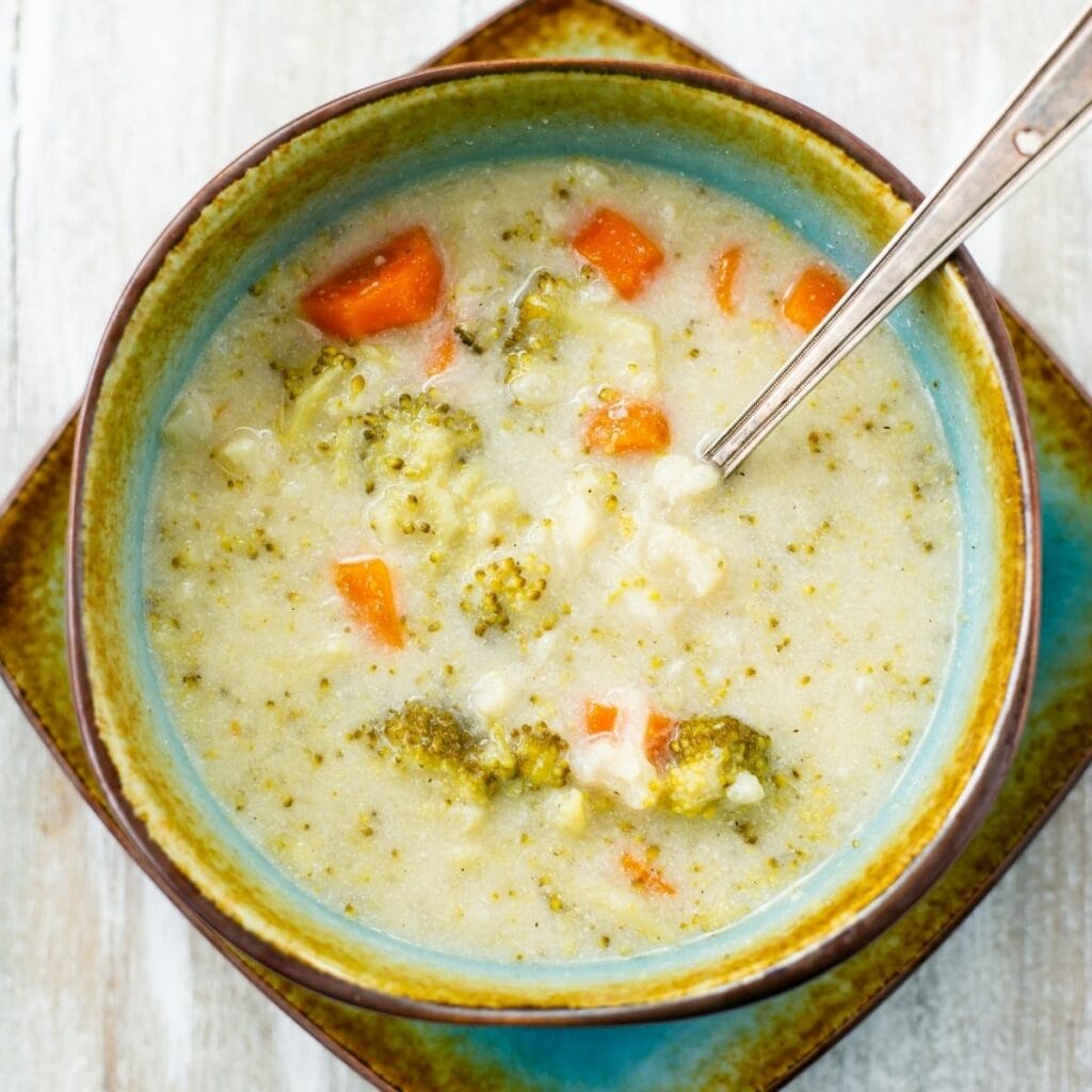 A bowl of creamy cauliflower and broccoli soup.