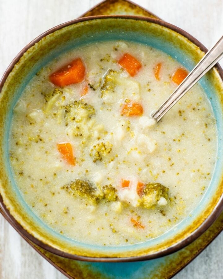A bowl of creamy cauliflower and broccoli soup.