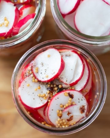 Sweet Pickled Radishes in mason jars
