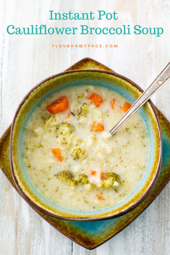 Creamy Pressure Cooker Cauliflower Broccoli Soup recipe served in a teal and brown soup bowl