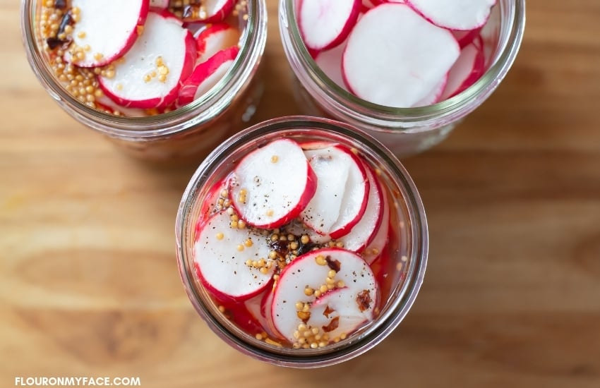 Sweet Pickled Radishes in mason jars