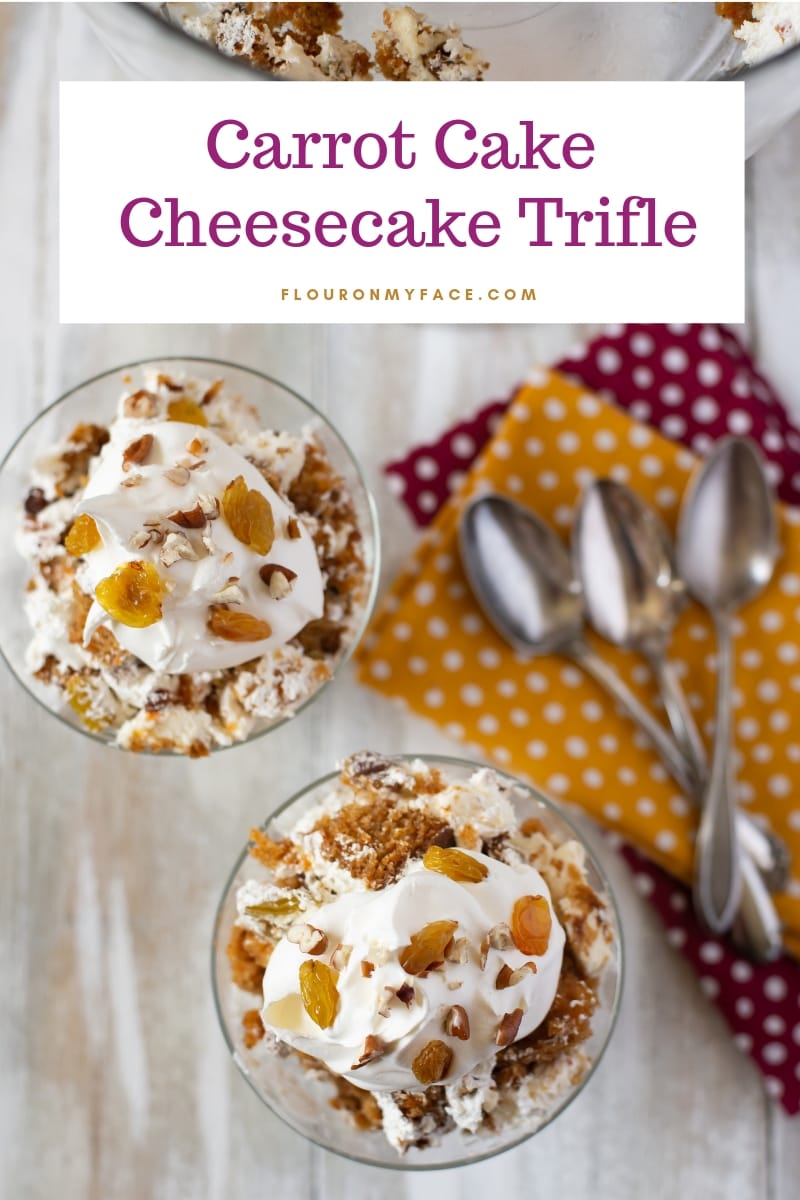 2 glass dessert bowls filled with Carrot Cake Cheesecake Trifle recipe, with cloth napkins and vintage silverware.