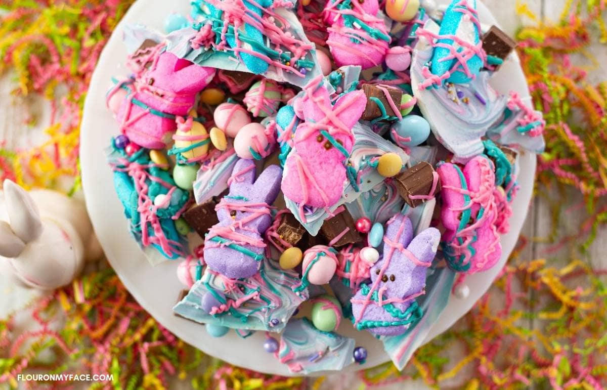 Easter Candy Bark piled on a white cake plate.