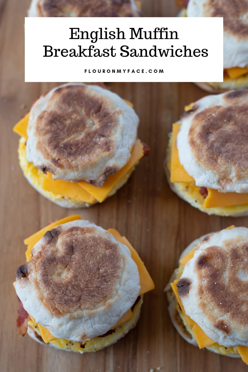 English Muffin Breakfast sandwiches on a wooden cutting board