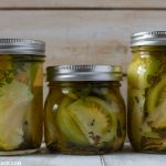 Three jars of quick pickled green tomatoes