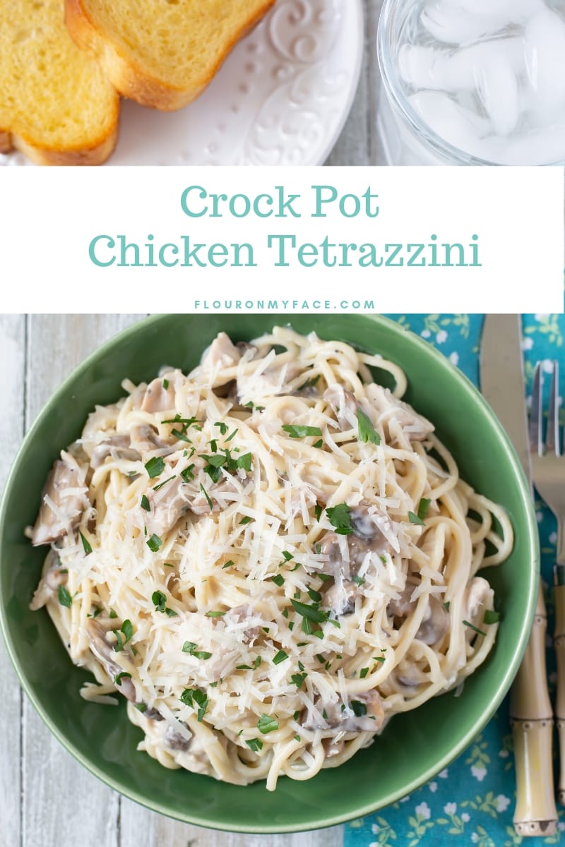 A green bowl filled with a serving of cream crock pot chicken tetrazzini recipe