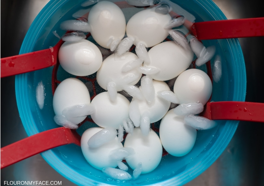 a bowl of ice water with hard boiled Instant Pot eggs