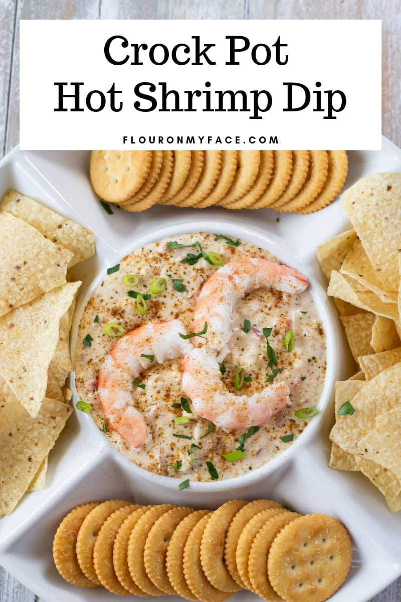 Crock Pot Hot Shrimp Dip recipe served in a sip plate with chips and crackers