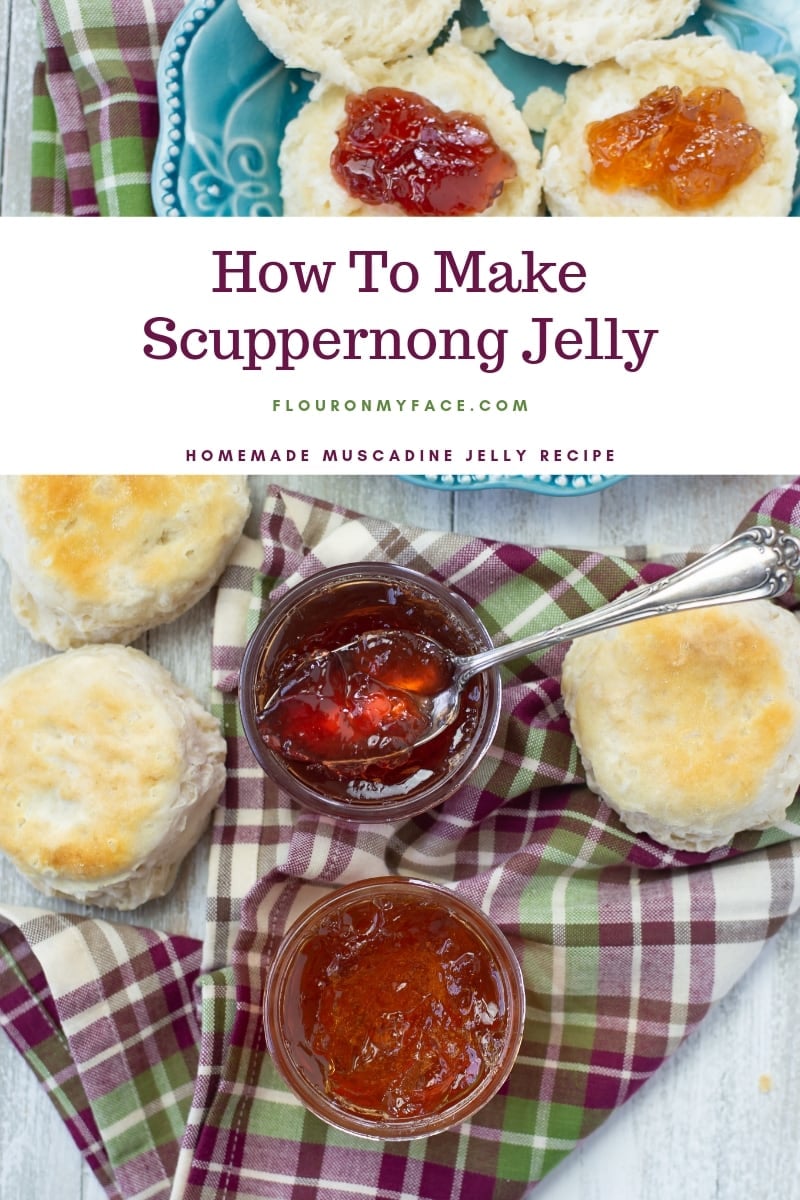 Two jars of homemade scuppernong jelly with freshly baked biscuits on a cloth napkin.