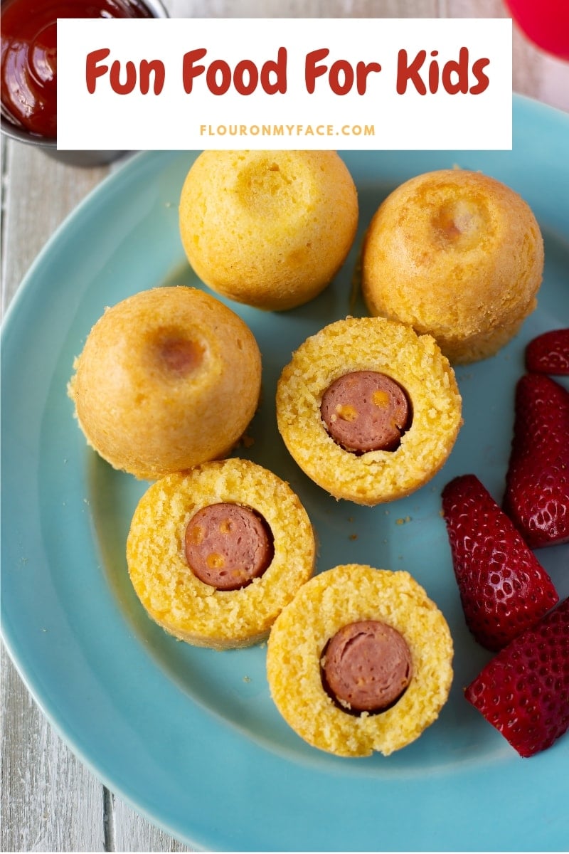 Freshly made Instant Pot Corn Dogs bites served with fresh strawberries and ketchup for lunch or dinner.