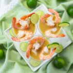 3 mini appetizer cups filled with shrimp in a Key Lime Mustard Sauce.