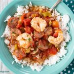 Slow cooker Jambalaya recipe served over white rice in a bowl