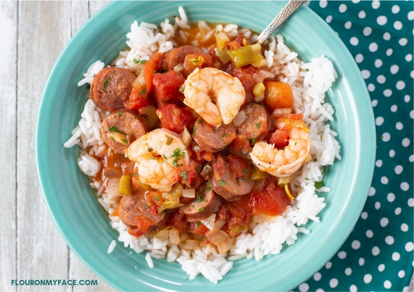 Slow cooker Jambalaya recipe served over white rice in a bowl