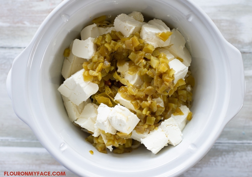 Crock Pot with White Queso Dip ingredients.