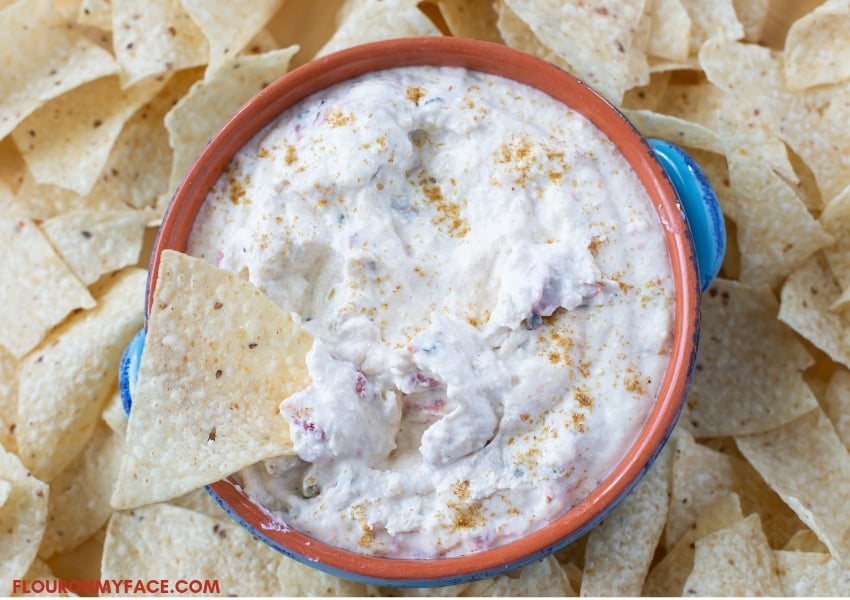 Terra cotta bowl filled with hot Crock Pot White Queso Dip