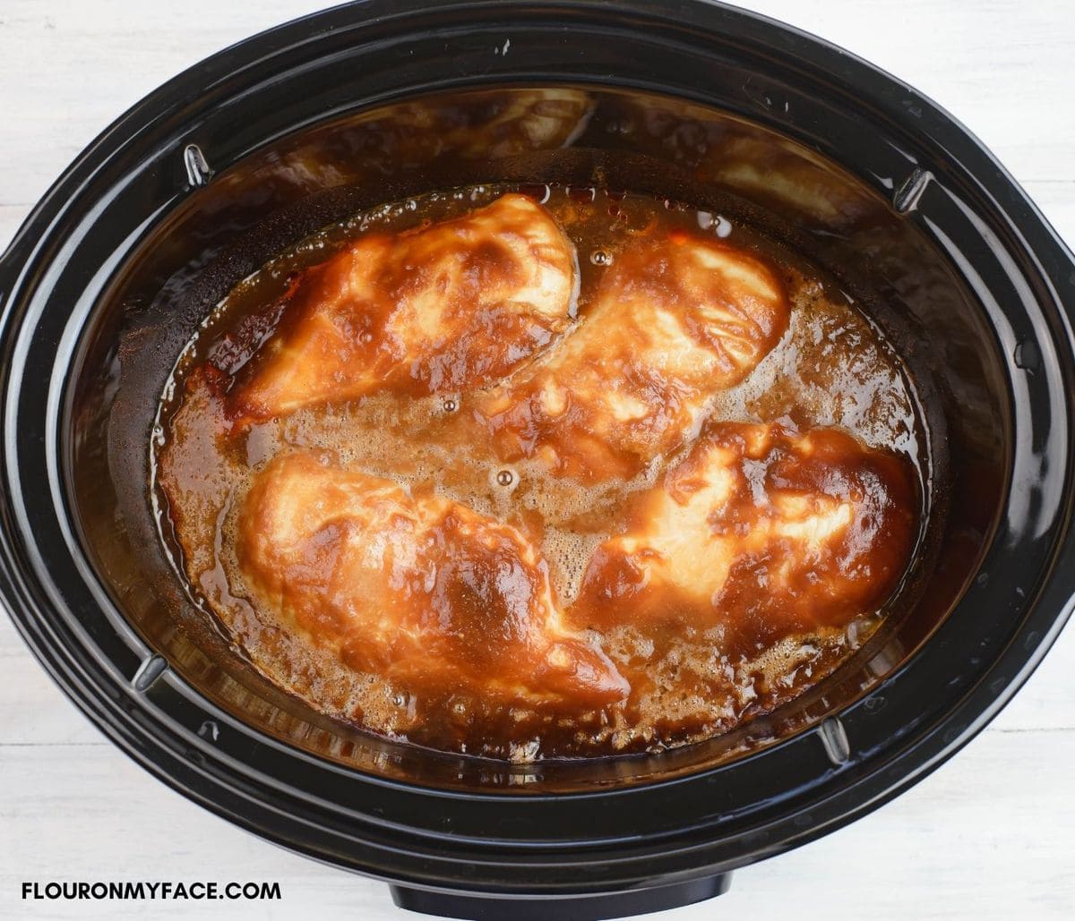 Crock Pot Barbecued Chicken before shredding in a slow cooker.