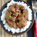 serving homemade pepper steak over white rice for dinner.