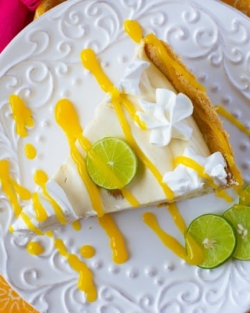 Mango Key Lime Pie on a white glass dessert plate