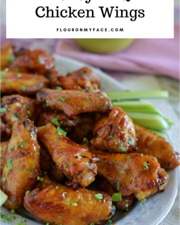 a serving platter full of Honey BBQ Chicken Wings to serve as a party appetizer.