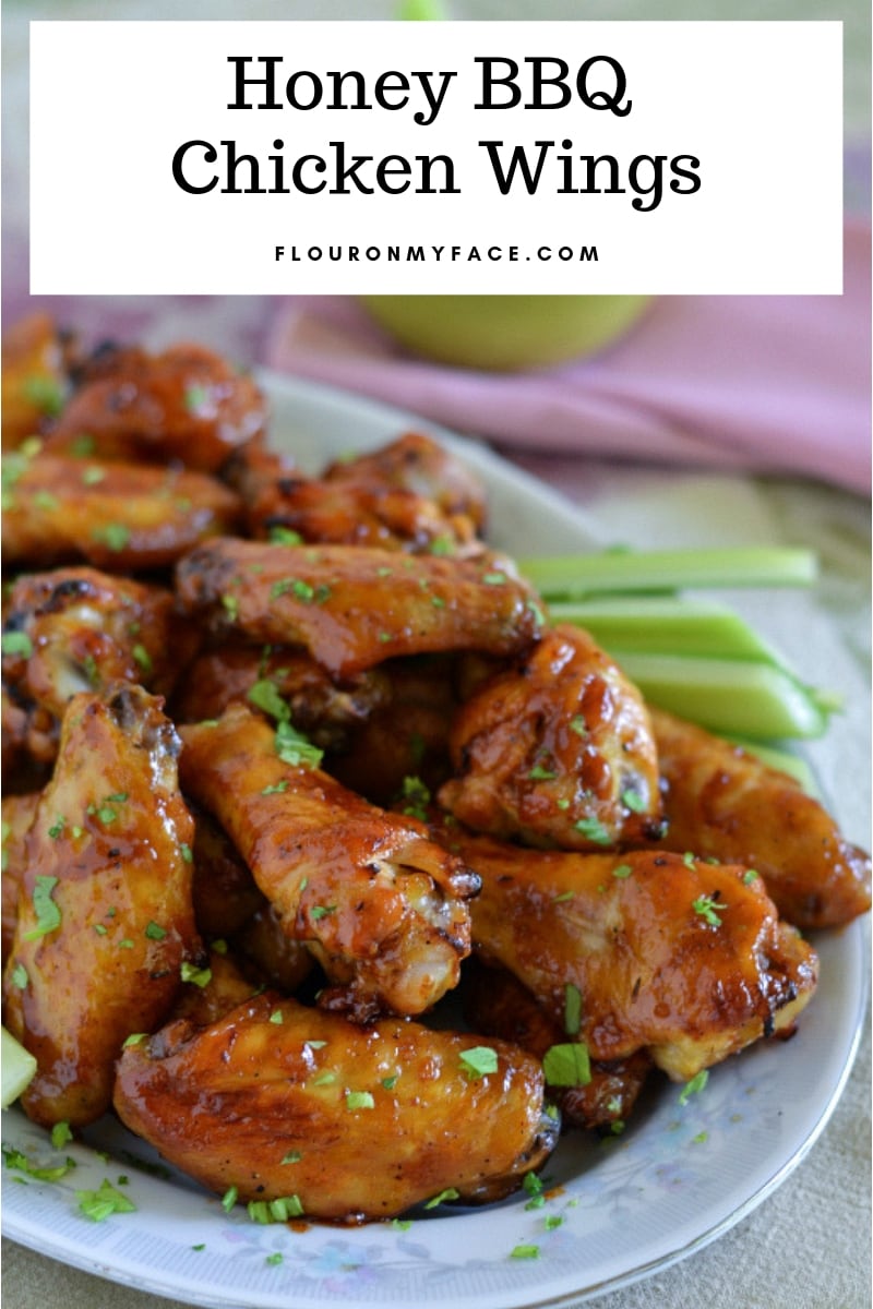 a serving platter full of Honey BBQ Chicken Wings to serve as a party appetizer.