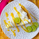 Mango Key Lime Pie on a white glass dessert plate