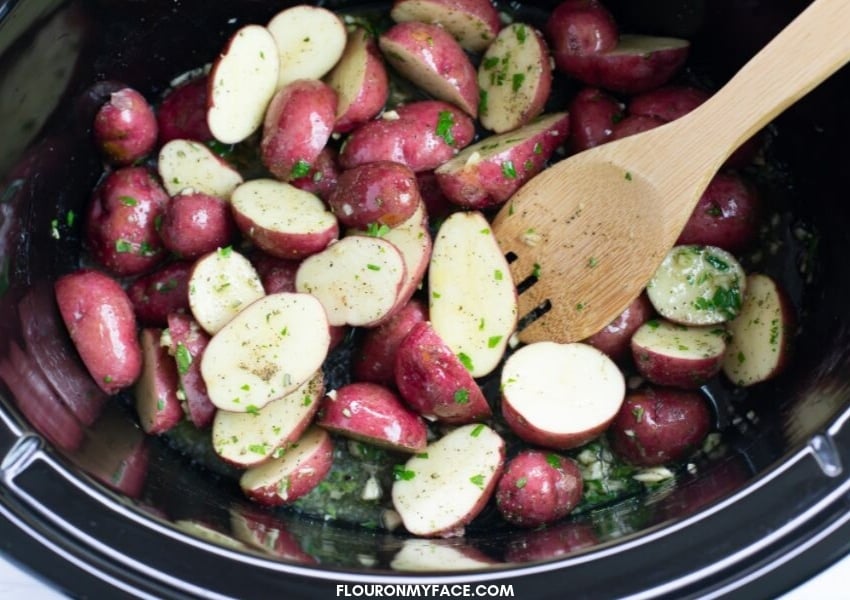 Baby red potatoes covered in olive oil and butter and tossed with fresh rosemary, parsley and minched garlic.