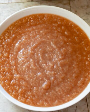 Homemade applesauce made in the Instant Pot in a white bowl.