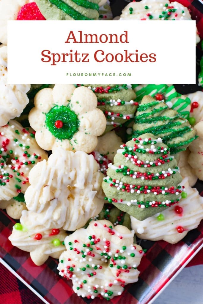 A holiday plate with a variety of examples of how you can decorate Almond Spritz Cookies